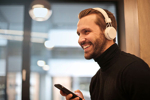 man-wearing-white-headphones-listening-t